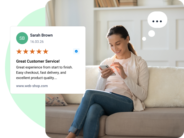 Young woman writing a review on her mobile phone.